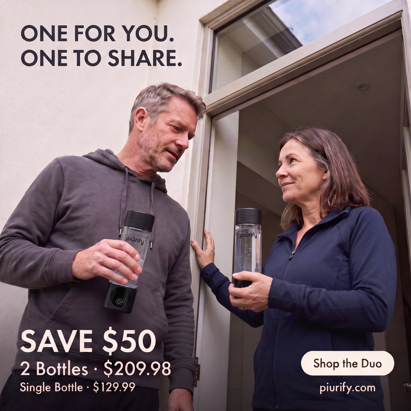 Couple at their front door, each holding a bottle