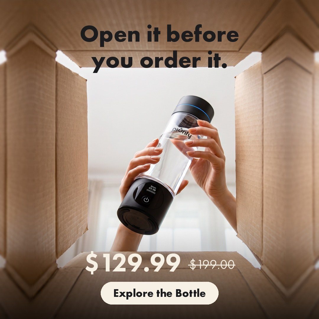 Hands lifting the bottle out of a shipping box, seen from inside the box