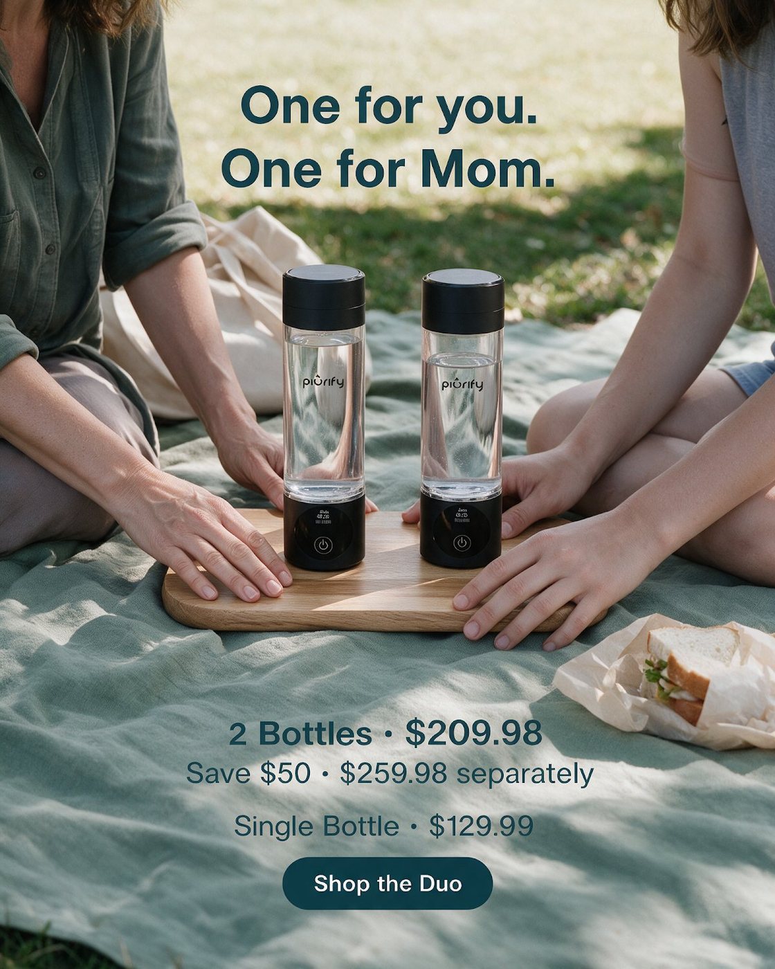 Two people setting two bottles on a picnic board